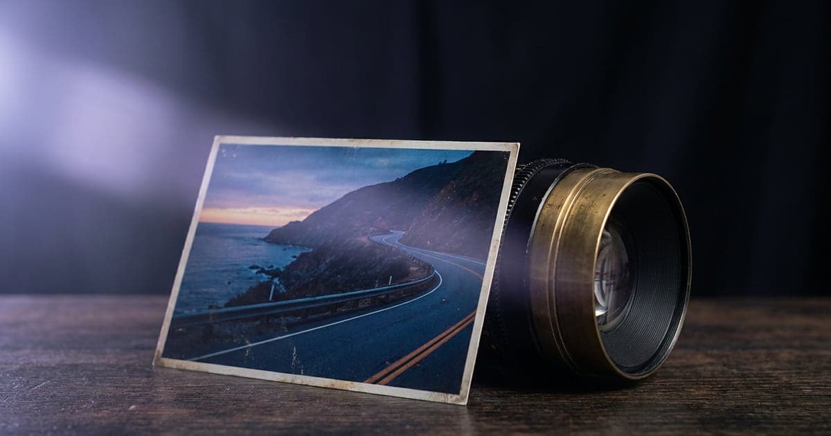 A still photograph propped against a camera lens, the scene in it seeming to move.