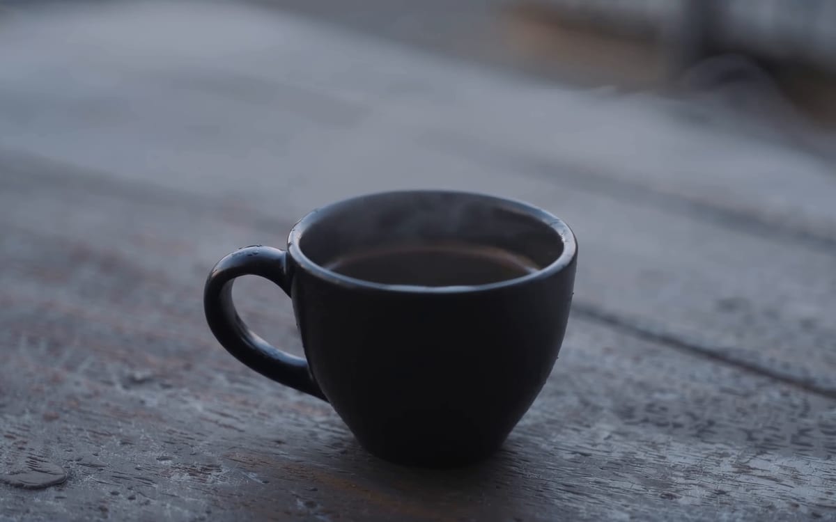 A first frame from an LTX clip: steam rising off a cup on a cold morning.